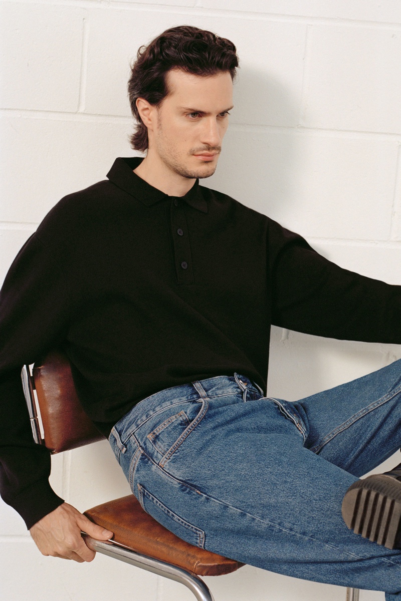Delivering a side profile, Tristan Pigott wears a long-sleeve polo from COS with regular fit recycled cotton jeans. » COS Pushes for Sustainability with Fall '20 Denim Line Delivering a side profile, Tristan Pigott wears a long-sleeve polo from COS with regular fit recycled cotton jeans.