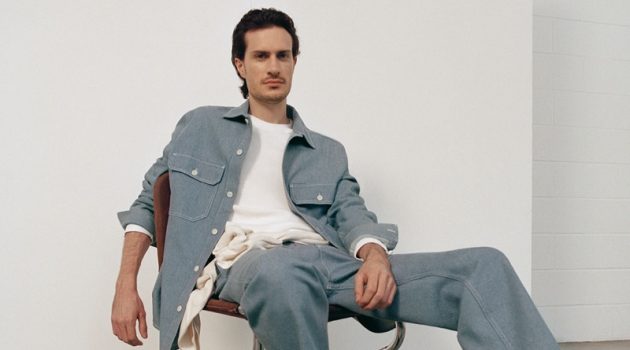 COS Pushes for Sustainability with Fall '20 Denim Line Figurative artist Tristan Pigott connects with COS for fall. He poses in the brand's organic cotton utility-style denim overshirt with a pair of recycled cotton denim cargo trousers.
