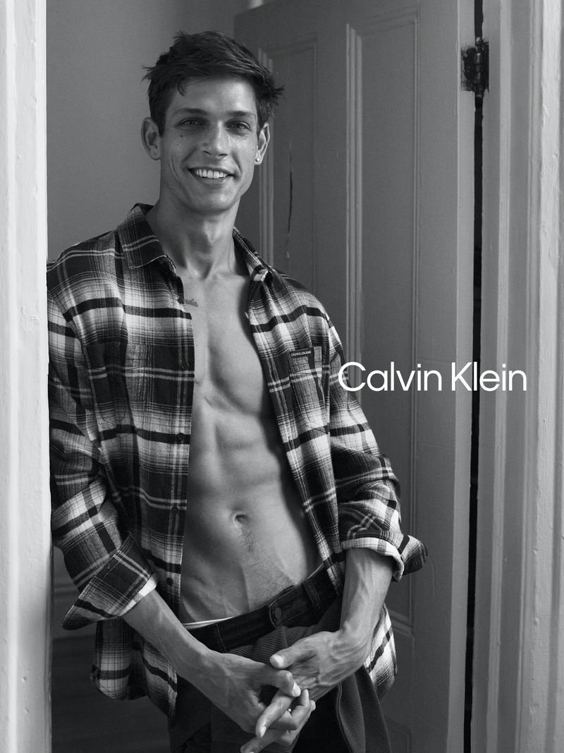 All smiles, Ethan James Green wears a plaid shirt with jeans for Calvin Klein's fall 2020 #MyCalvins campaign.