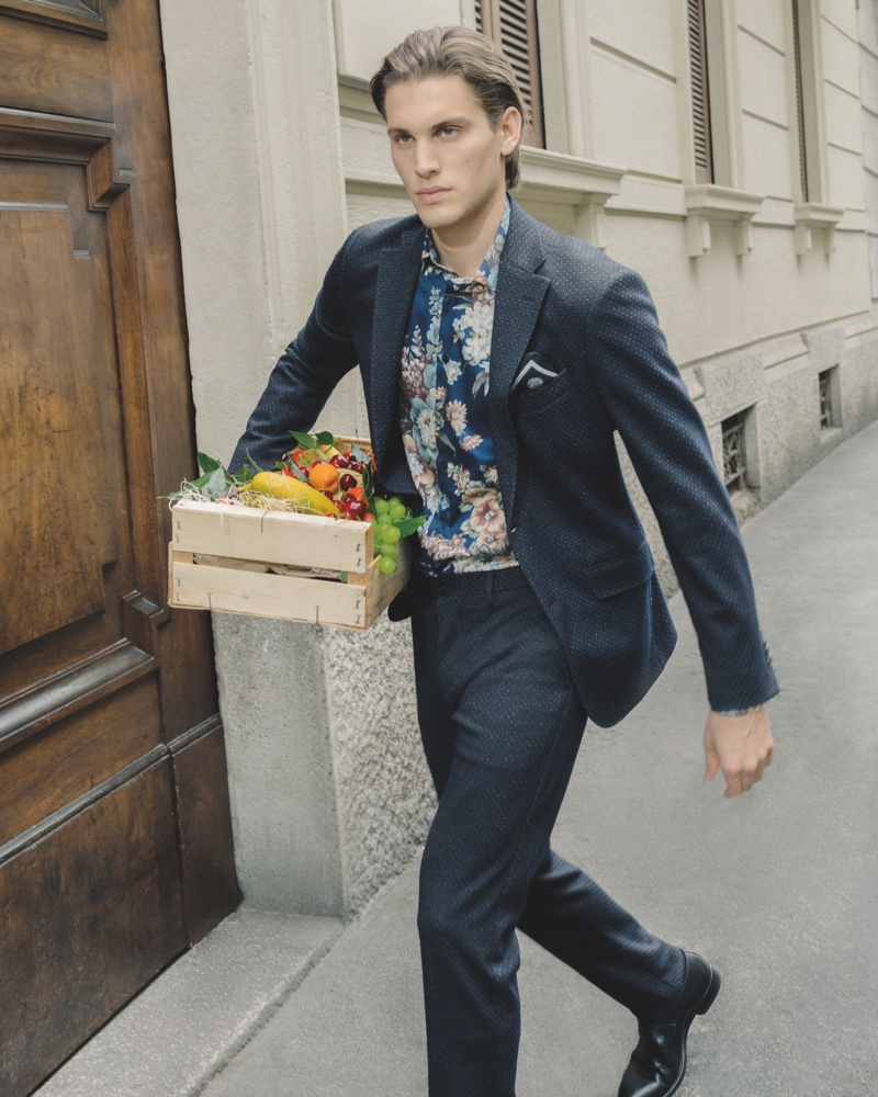 On the move, Maxime Trabouile sports Etro's 24 Hour jacket in a micro-geometric print.