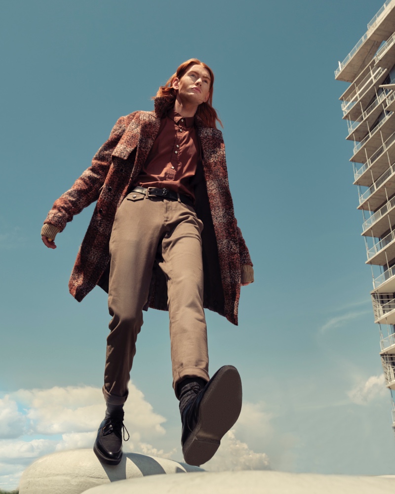 Jayden wears hand warmers Aldo, dress pants Christopher Bates, belt, shoes, and socks H&M, checkered coat and rust orange shirt Shelli Oh.