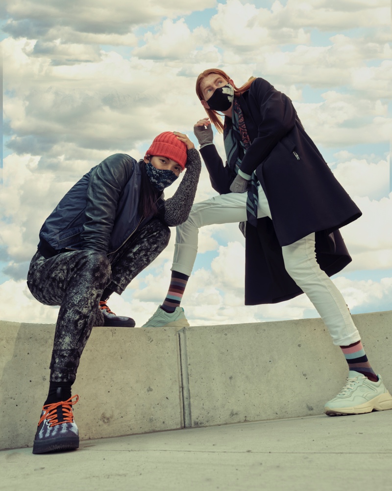 Left: Sooleen wears bomber Hip and Bone, beanie Leone Napoli, sneakers Puma, printed mask Mayer Man Custom, tank and pants House of Dwir. Right: Jayden wears hand warmers Aldo, socks Hudson's Bay, sneakers Hip and Bone, mask, Mayer Man Custom, pants and scarf H&M, sweater and trench Christopher Bates. » Jayden & Sooleen in 'Layered Up' Left: Sooleen wears bomber Hip and Bone, beanie Leone Napoli, sneakers Puma, printed mask Mayer Man Custom, tank and pants House of Dwir. Right: Jayden wears hand warmers Aldo, socks Hudson's Bay, sneakers Hip and Bone, mask, Mayer Man Custom, pants and scarf H&M, sweater and trench Christopher Bates.