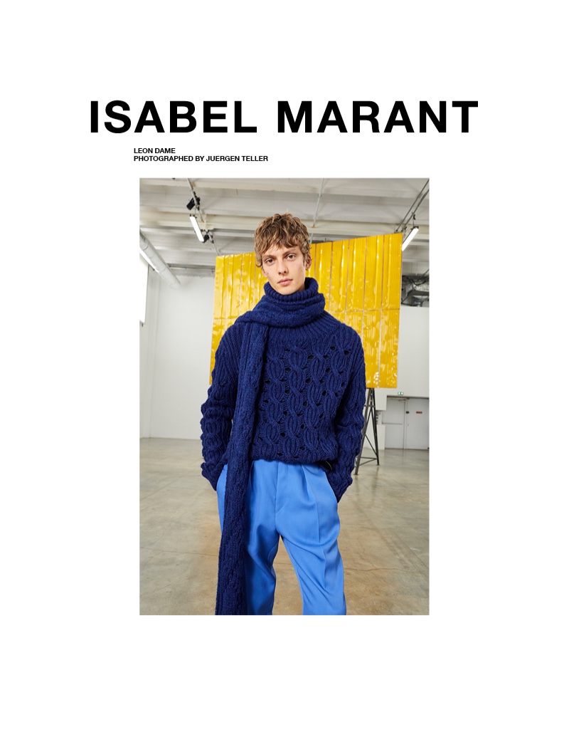 Leon Dame dons a matching cableknit scarf and sweater with pleated trousers for Isabel Marant's fall-winter 2020 campaign.