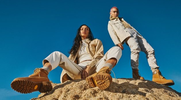 Jimmy Choo Breaks Ground with Timberland Collaboration Traveling out to the Californian desert, Evan Mock and Kristen Noel Crawley front the Jimmy Choo x Timberland campaign. The pair dons wheat gold nubuck with glitter spray boots.