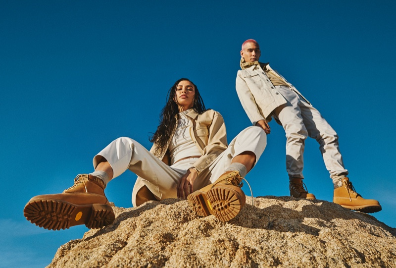 Traveling out to the Californian desert, Evan Mock and Kristen Noel Crawley front the Jimmy Choo x Timberland campaign. The pair dons wheat gold nubuck with glitter spray boots.