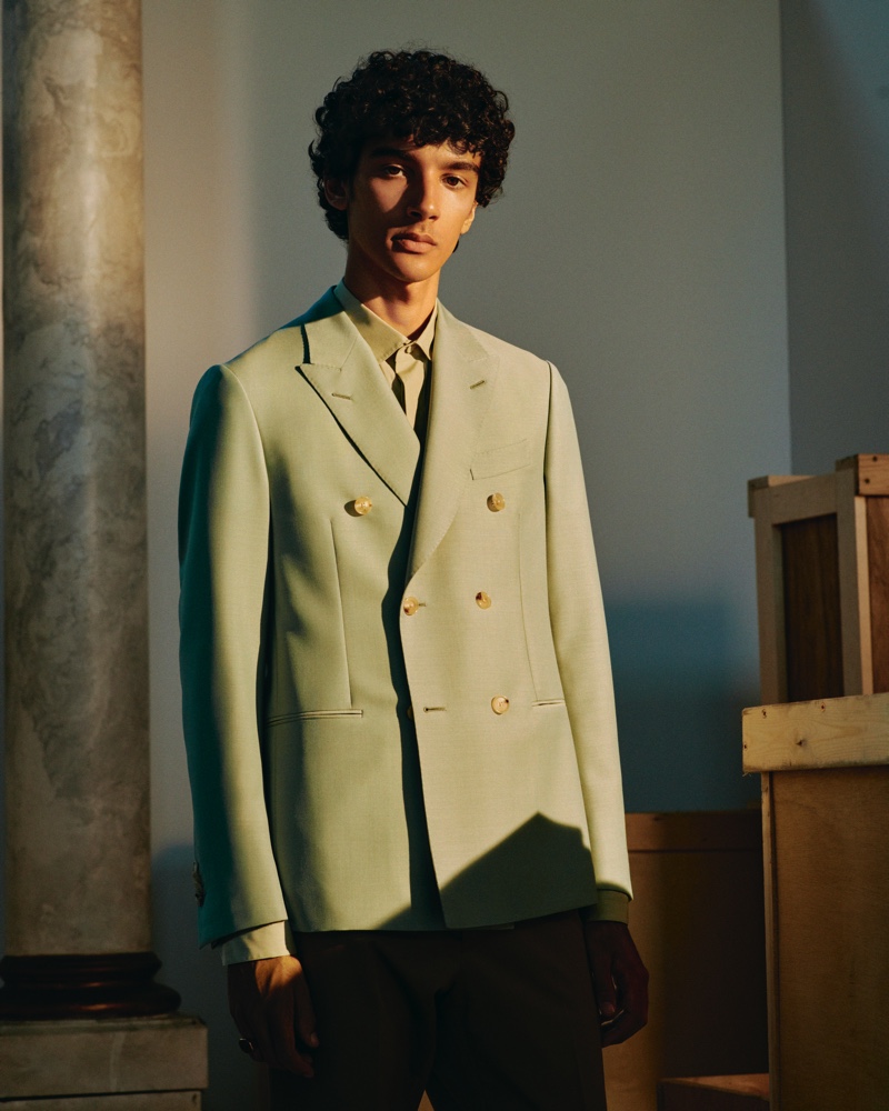 Suiting up in Caruso, Callum Stoddart models a double-breasted wool and mohair-blend blazer with a cutaway-collar cotton shirt from Mr Porter's Italian Masters collection.