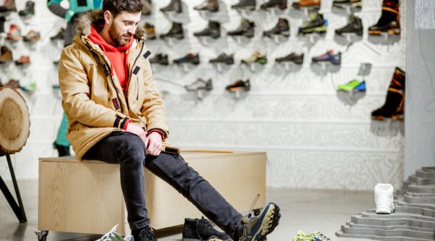 These Hacks Will Make Shoe Shopping a Breeze Man Trying on Shoes in Store
