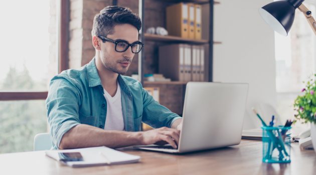 Great Ideas to Make Money Without Leaving Home Man Wearing Glasses Working on Laptop