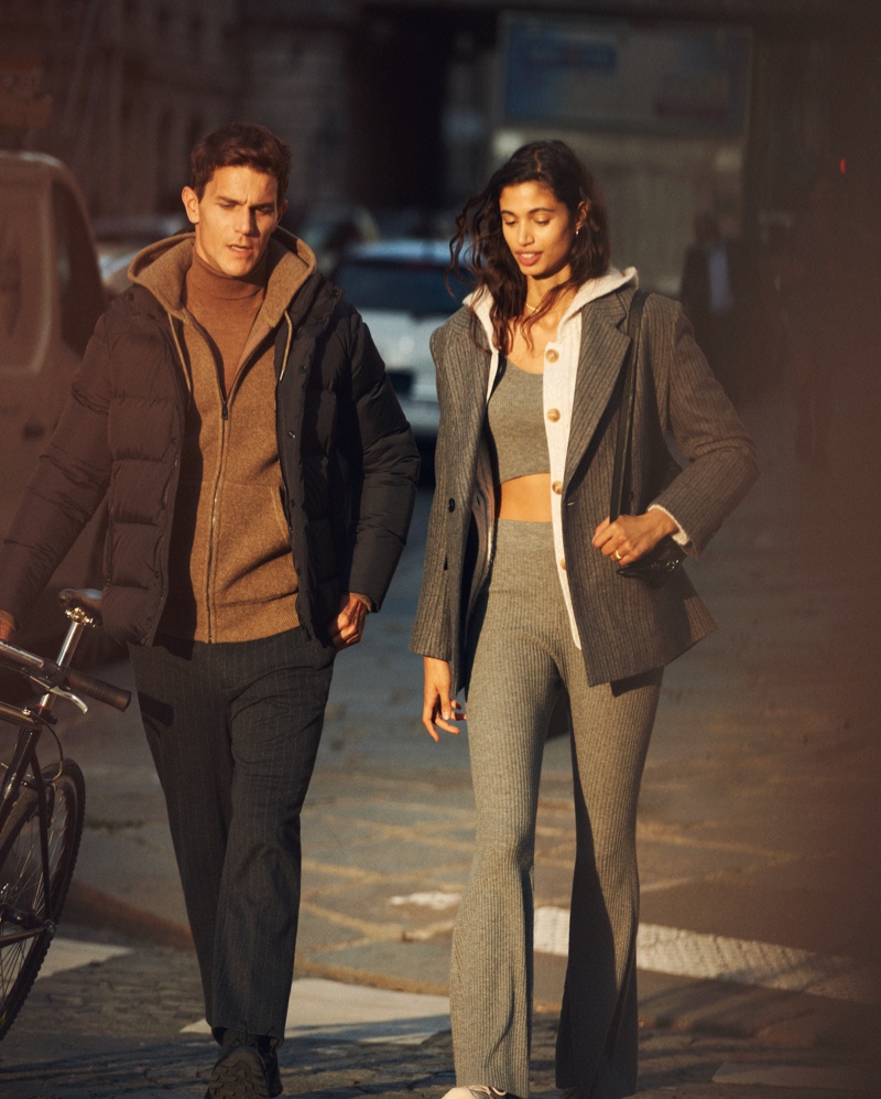 Taking a stroll, models Vincent Lacrocq and Malika El Maslouhi showcase fashions from Mango's Comfy collection.