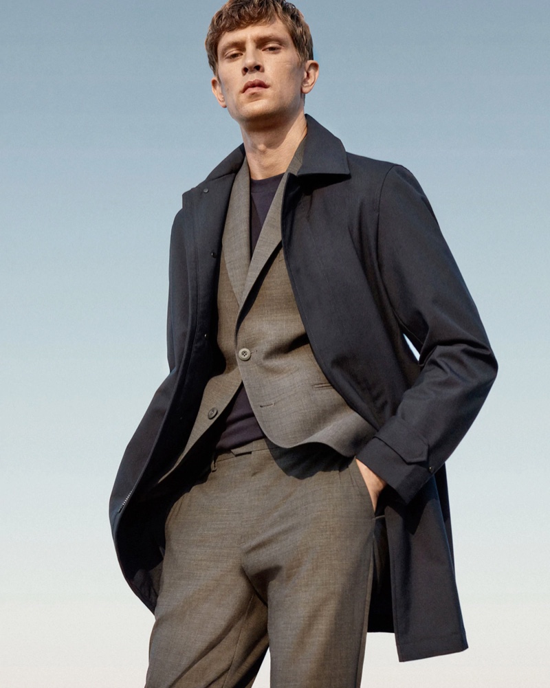 Front and center, Mathias Lauridsen models a gray suit with a navy coat from Mango's Improved collection.