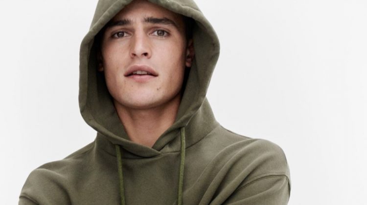 Parker van Noord rocks a green hoodie for Marc O'Polo's fall-winter 2020 campaign.