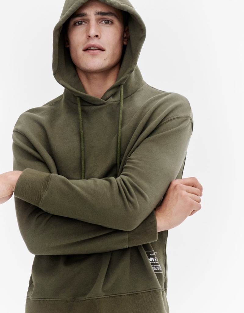 Parker van Noord rocks a green hoodie for Marc O'Polo's fall-winter 2020 campaign.