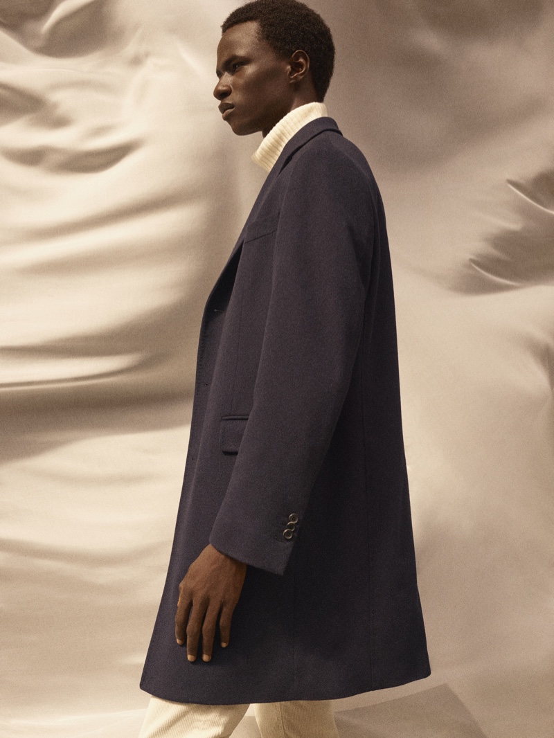 Malick Bodian dons a sleek coat and ribbed turtleneck sweater from Massimo Dutti's fall-winter 2020 Limited Edition men's collection.