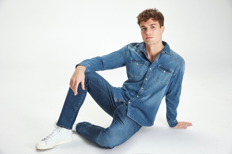 Doubling down on denim, Jacques Stephan Pougnet models a denim shirt and distressed jeans from Mavi's fall-winter 2020 collection.