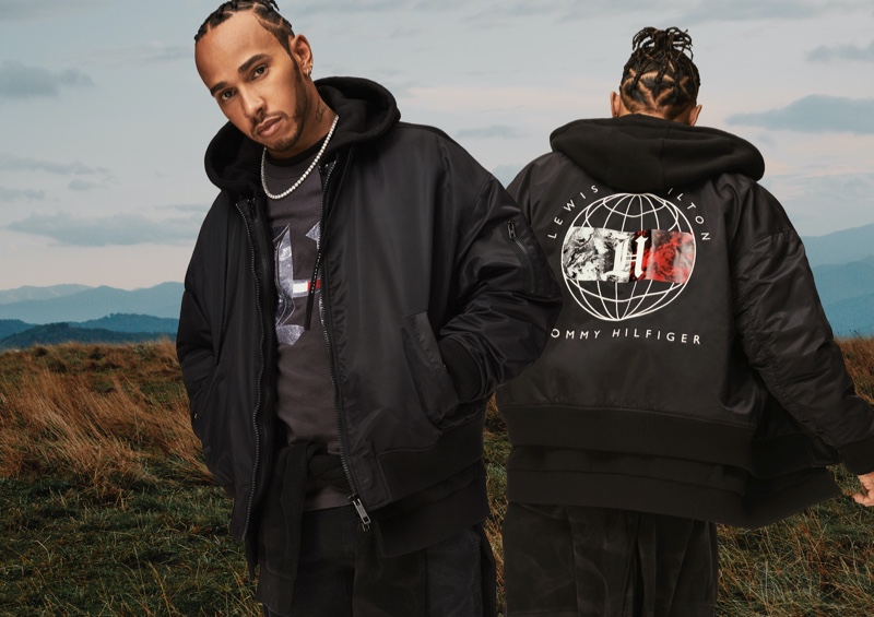 Tommy Hilfiger global brand ambassador Lewis Hamilton sports a black bomber, which is part of his fall-winter 2020 TommyxLewis line.