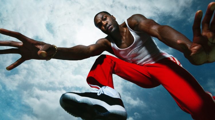 Dana Scruggs photographs Yahya Abdul-Mateen II for Men's Health. He wears a vintage mesh tank with Wales Bonner track pants and Jordan sneakers.
