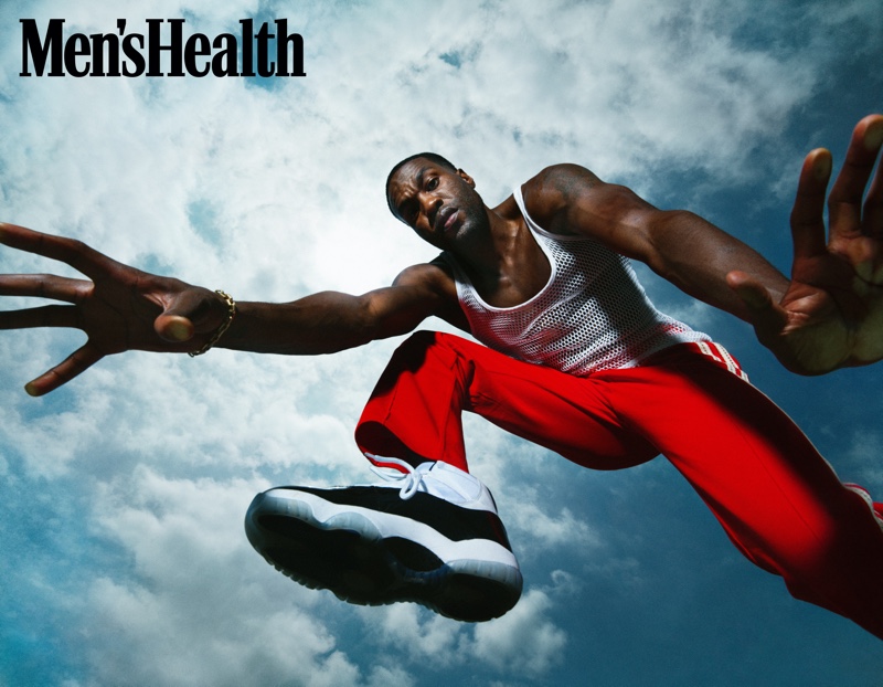 Dana Scruggs photographs Yahya Abdul-Mateen II for Men's Health. He wears a vintage mesh tank with Wales Bonner track pants and Jordan sneakers.