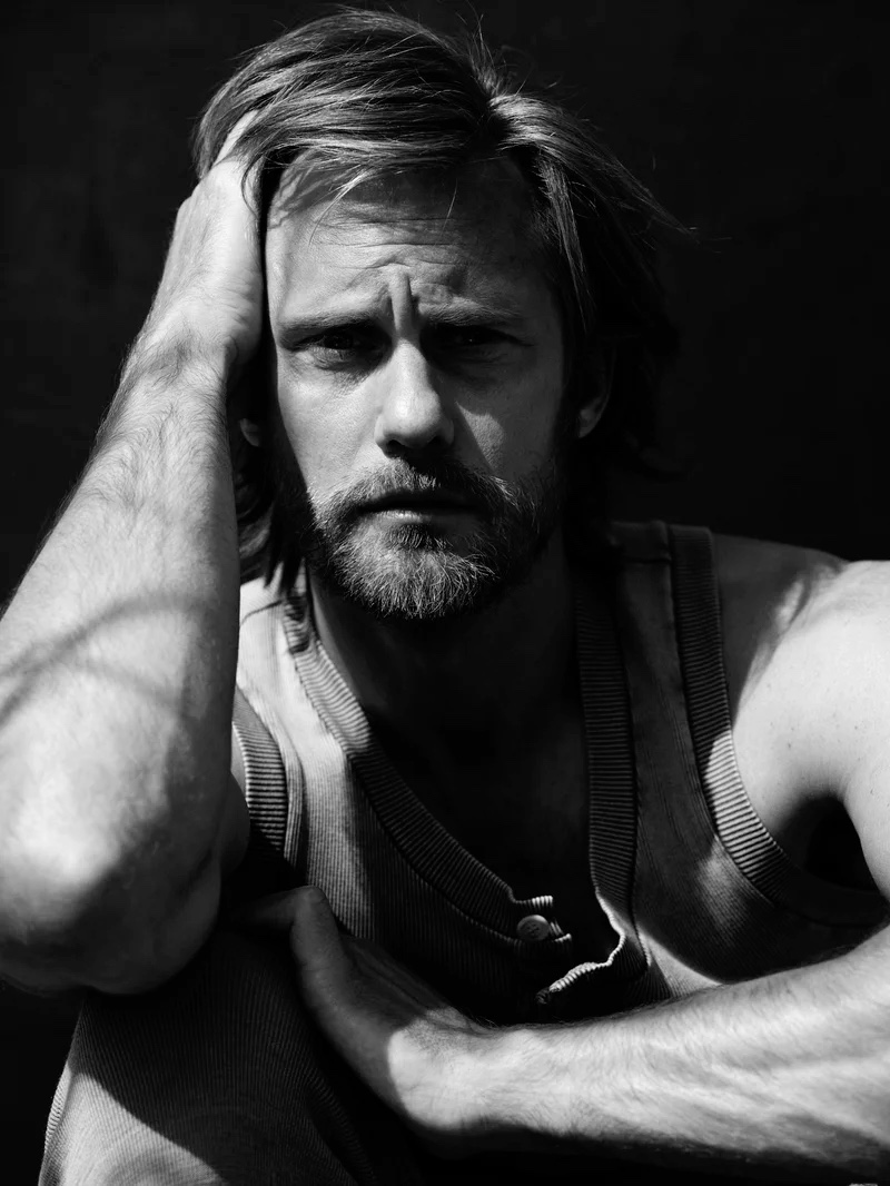 Appearing in a black and white image for L'Uomo Vogue, Alexander Skarsgård dons a look from Dolce & Gabbana.