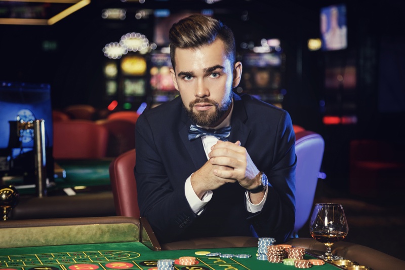 Attractive Man Suit Bow Tie Casino Table