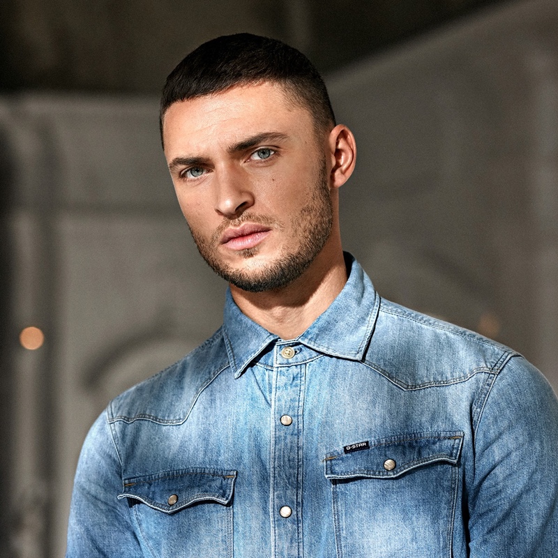 British model Harvey Haydon sports a denim shirt for G-Star Raw's fall-winter 2020 men's campaign.