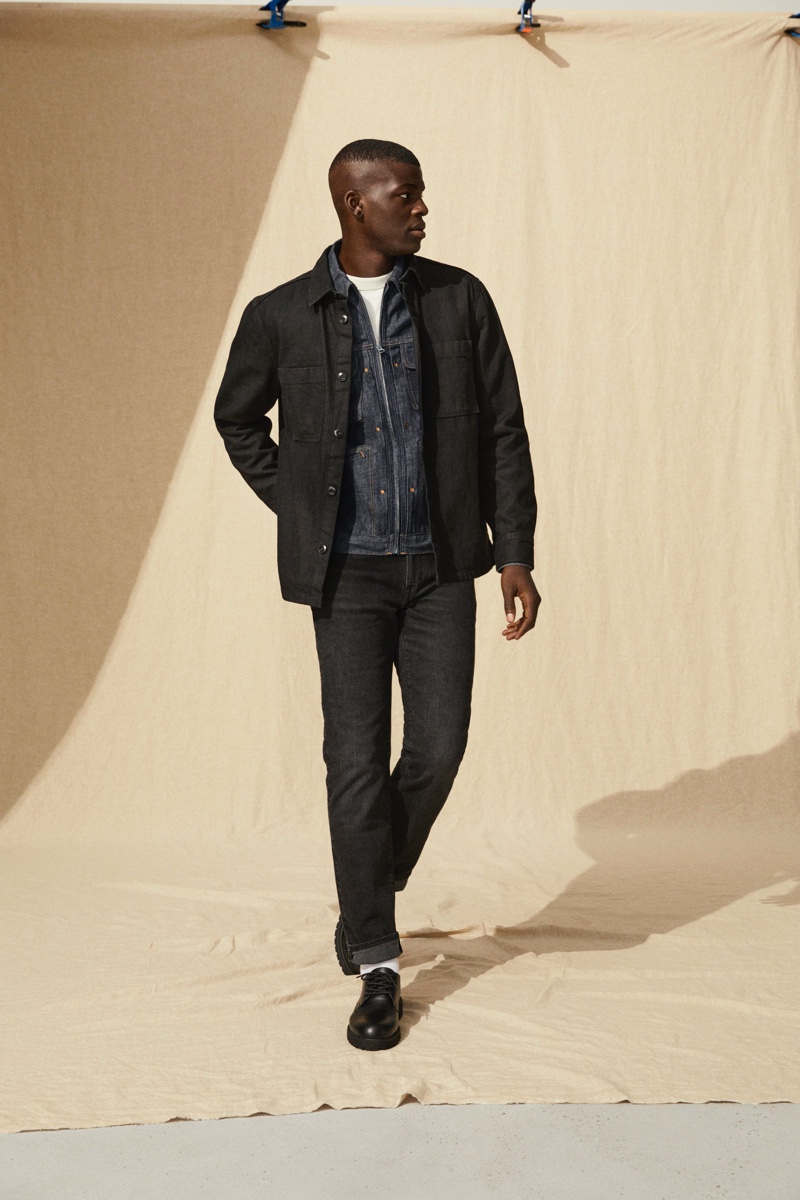 Hitting the studio, model Evandro Laurens showcases denim fashions from H&M's Jeans Redesign collection.