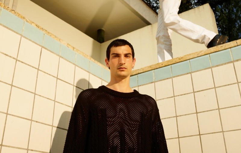 Sporting a knitted fishnet sweater, Luca Lemaire stars in LGN Louis-Gabriel Nouchi's fall-winter 2020 campaign.