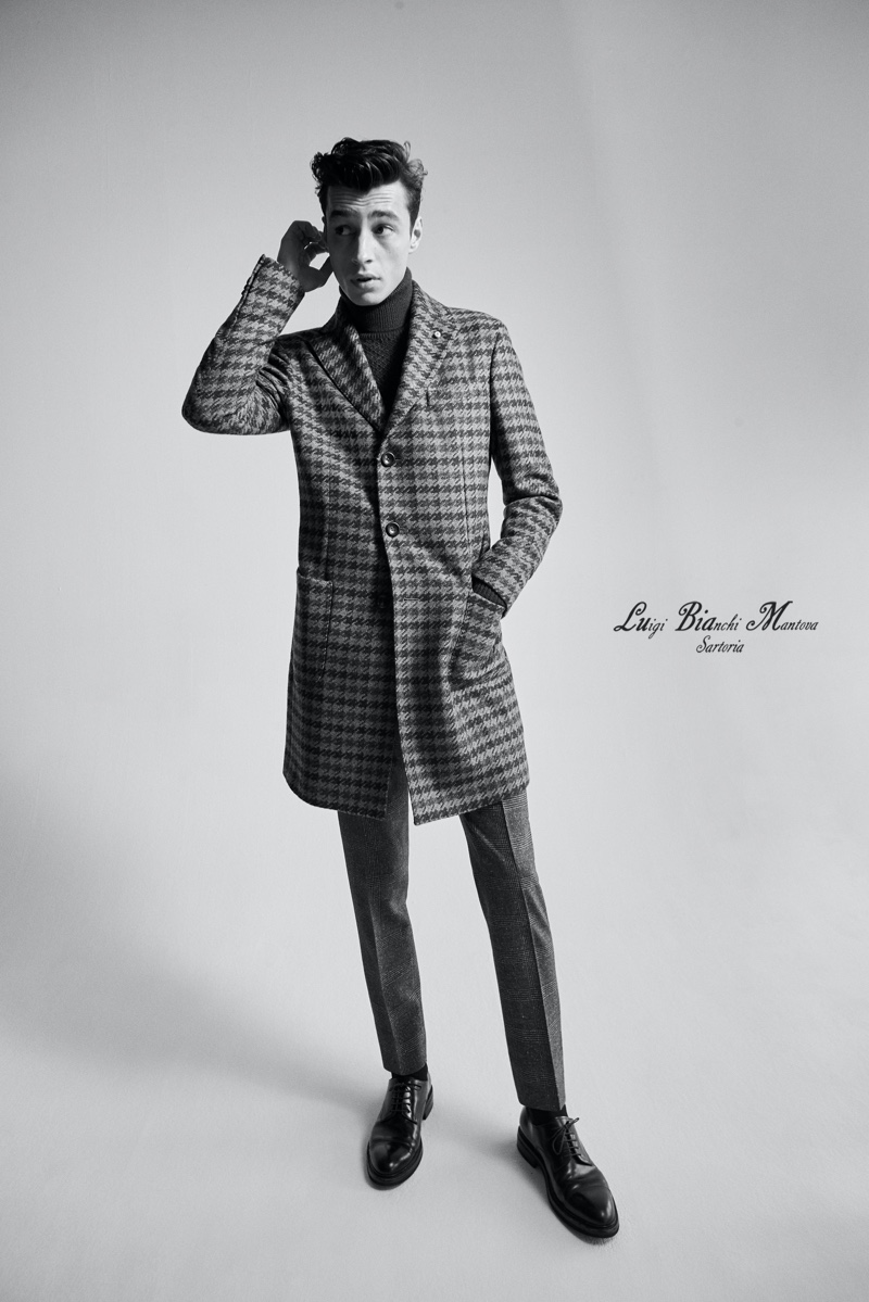 Front and center, Adrien Sahores hits the studio in a houndstooth coat from Luigi Bianchi Mantova's fall-winter 2020 collection.