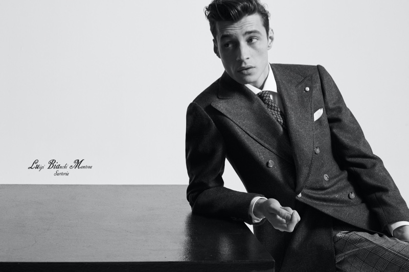 French model Adrien Sahores dons a double-breasted jacket with checked pants from Luigi Bianchi Mantova. » Adrien Suits Up for Luigi Bianchi Mantova Fall '20 Campaign French model Adrien Sahores dons a double-breasted jacket with checked pants from Luigi Bianchi Mantova.