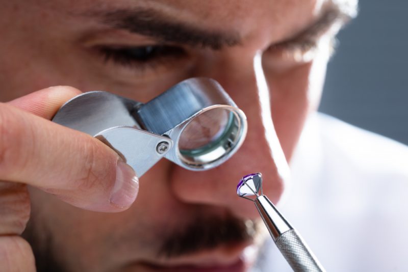 Man Inspecting Diamond 1 Man Inspecting Diamond