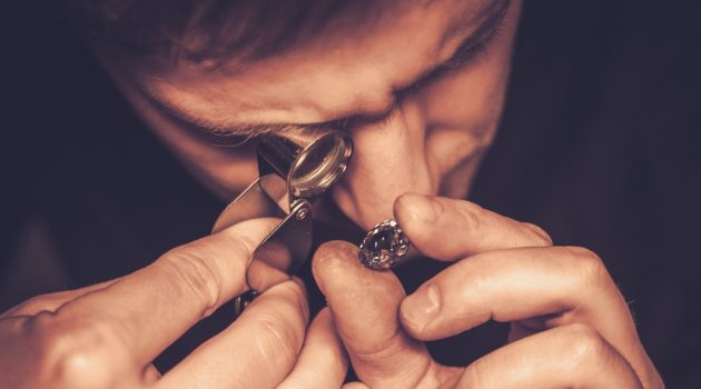 Which Diamond Clarity is Best? Man Inspecting Diamond