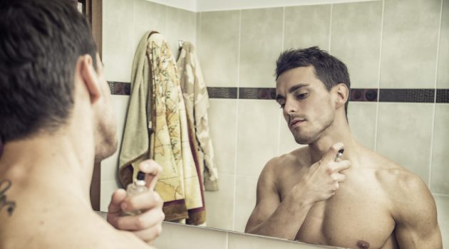 What Men Should Look for in a Fragrance Man Putting on Cologne