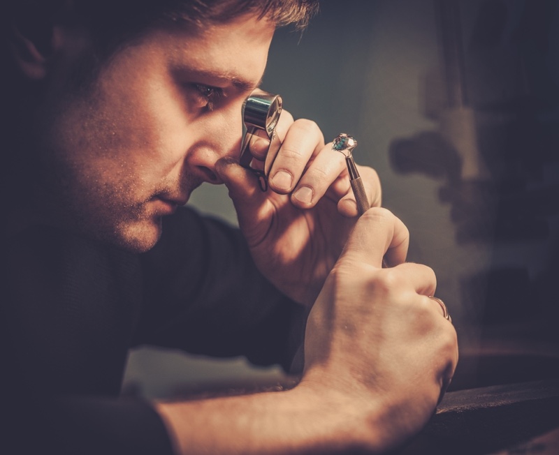 Man Studying Diamonds Jeweler Man Studying Diamonds Jeweler Examiner