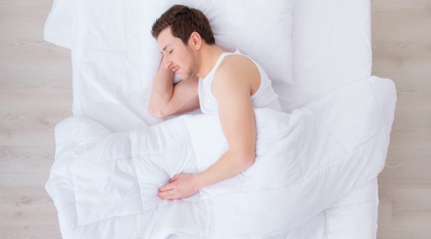 10 Tips to Beat Insomnia Man in Bed Down Comforter