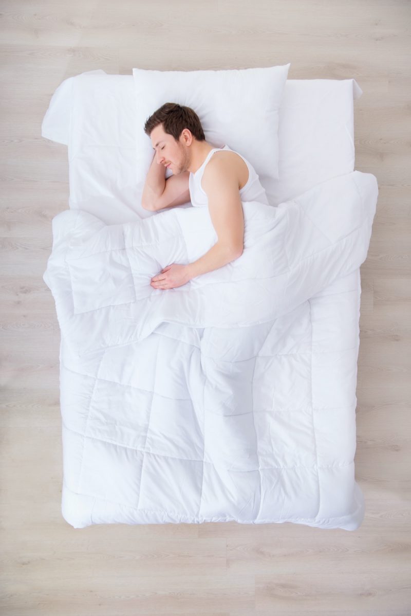 Man in Bed Down Comforter