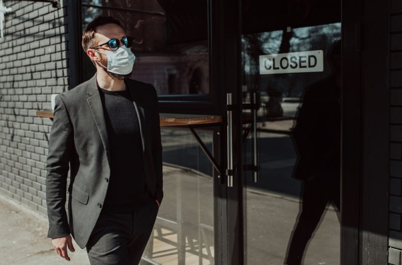 Man in Suit and Face Mask Outside