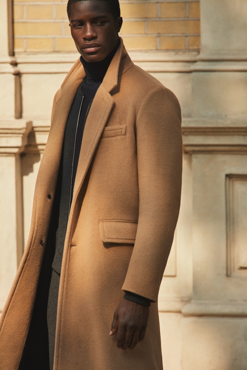 James Kakonge dons a sleek camel coat from Mr Porter's fall-winter 2020 Mr P. collection.