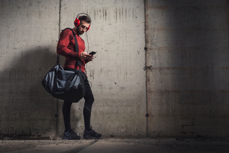 Muscular Man Stylish Outfit Gym Bag Headphones Muscular Man Stylish Outfit Gym Bag Headphones