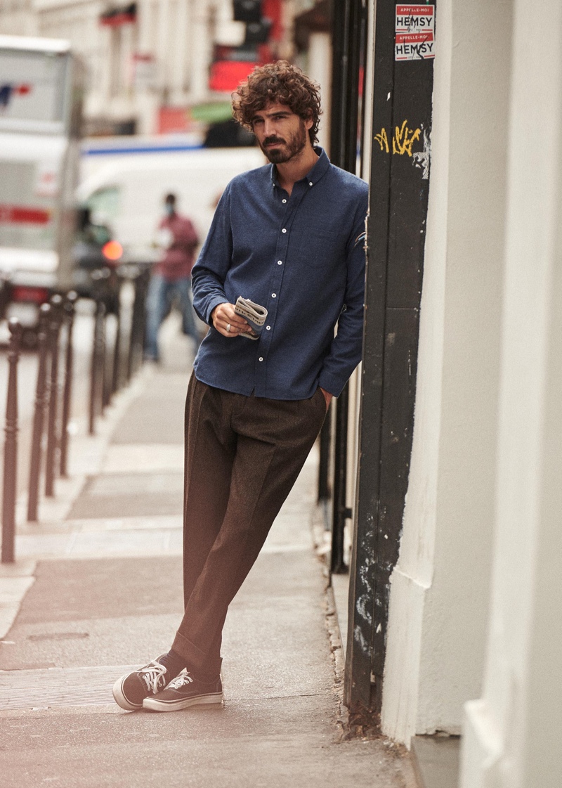 Photographed in the streets of Paris, Nono Marquis dons menswear from Octobre.