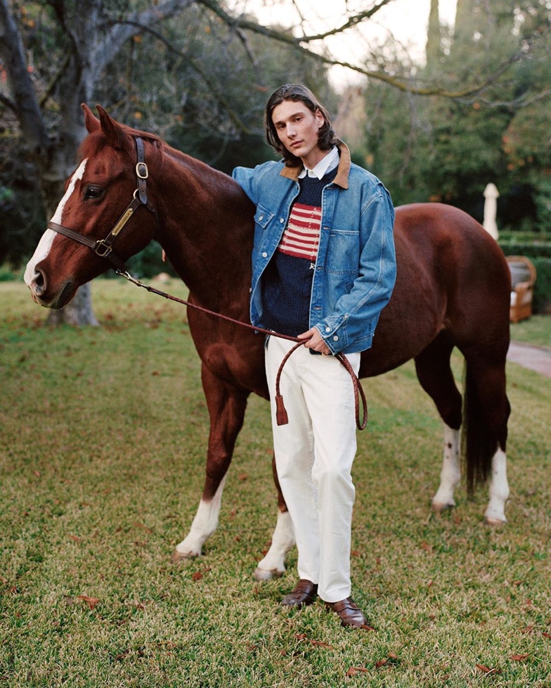 Making a casual case for denim, Wellington Grant wears a POLO Ralph Lauren jacket with one of the brand's iconic flag sweaters.