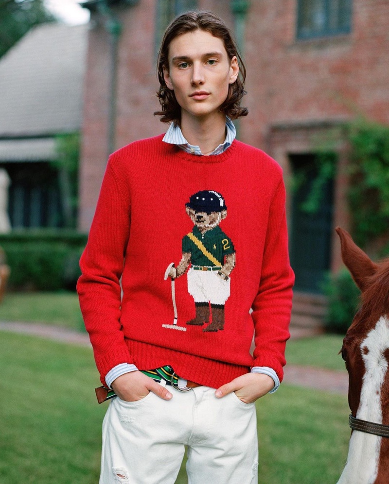 Wellington Grant dons POLO Ralph Lauren's red Riding Bear sweater from the brand's fall 2020 collection.