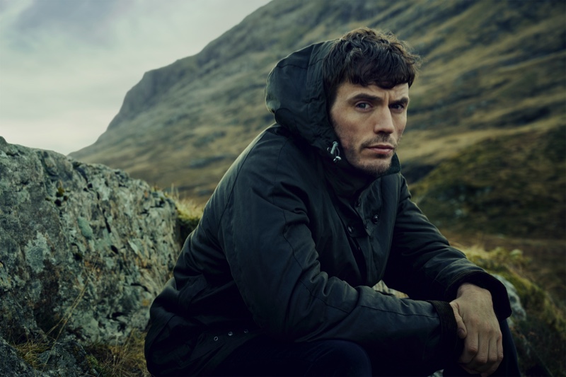 Traveling to Scotland for Barbour Gold Standard's fall-winter 2020 campaign, Sam Claflin wears a Supa Transporter wax jacket.