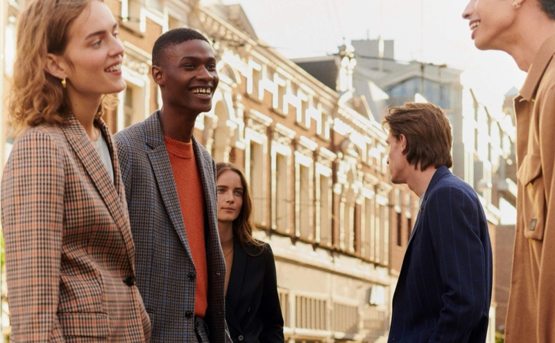 All smiles, Rachide Embalo appears in Scotch & Soda's fall-winter 2020 tailoring campaign, alongside models Edoardo Sebastianelli and Sol Goss.