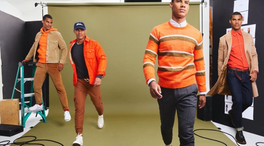 Vitor Melo makes a colorful statement in orange fashions from Todd Snyder's fall-winter 2020 collection. Pictured left to right: Vitor wears a Todd Snyder + Champion lightweight popover hoodie sweatshirt, Todd Snyder Italian quilted liner jacket, striped mohair sweater, and micro corduroy western shirt in orange.