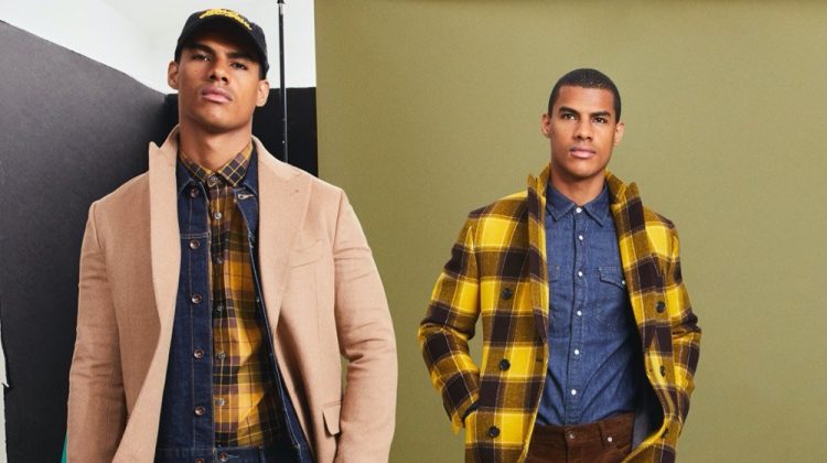 Clad in yellow and checks, Vitor Melo is ready to turn heads in Todd Snyder's Italian Buffalo plaid two-collar topcoat and mustard plaid flannel button-down shirt.