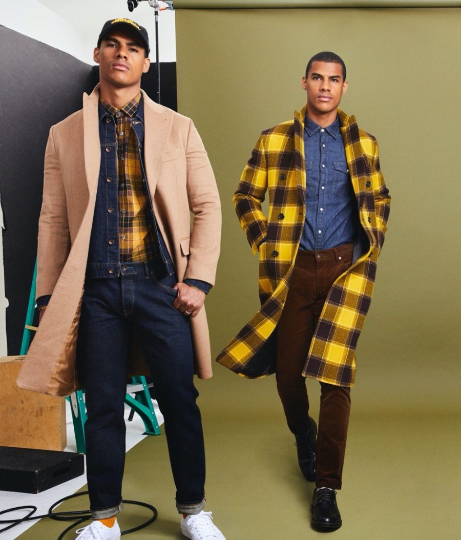 Clad in yellow and checks, Vitor Melo is ready to turn heads in Todd Snyder's Italian Buffalo plaid two-collar topcoat and mustard plaid flannel button-down shirt.