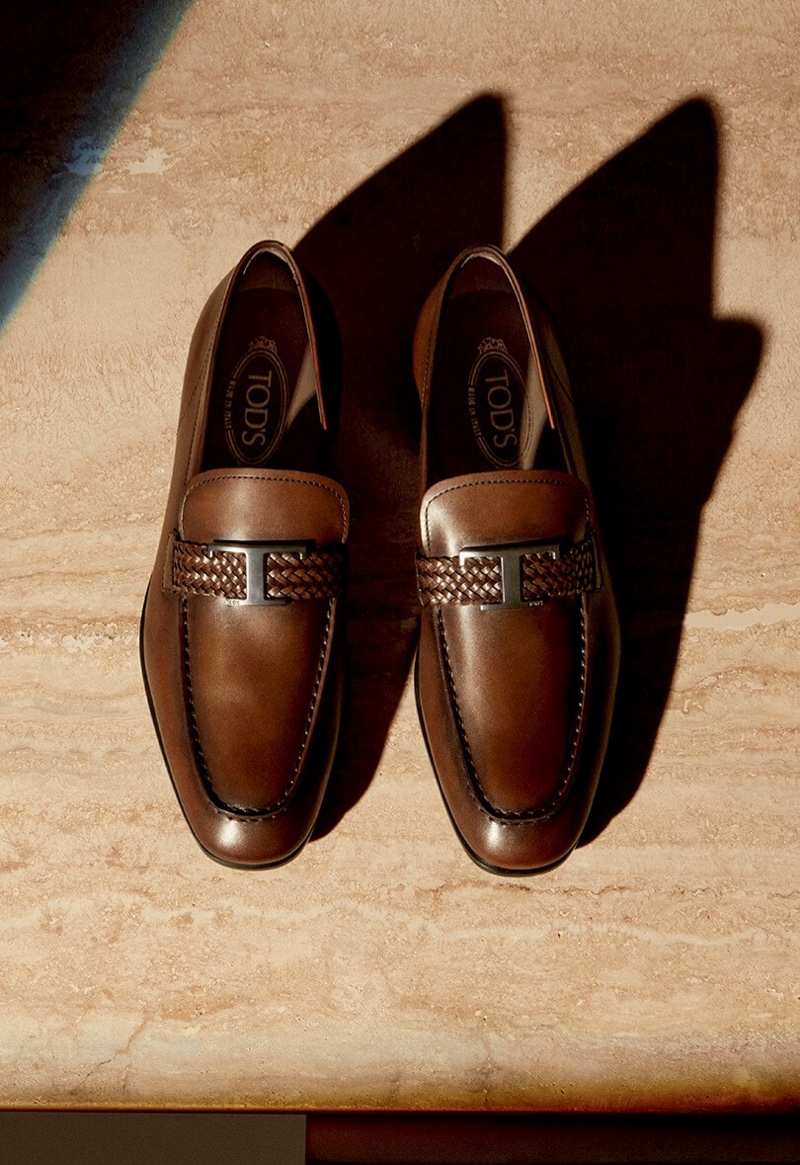 For Tod's fall-winter 2020 men's campaign, the footwear brand spotlights its luxurious, brown leather Timeless Gommino driving shoes.