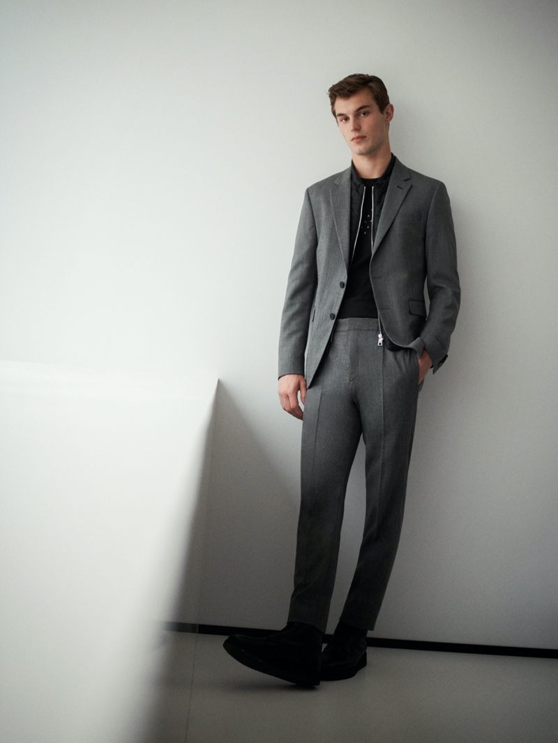 A sharp vision, Kit Butler wears a tailored suit from the fall-winter 2020 Tommy x Mercedes-Benz collection.