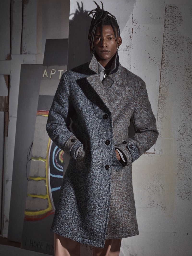 Ty Ogunkoya models a duo-tone herringbone coat for Zara's fall-winter 2020 men's campaign.