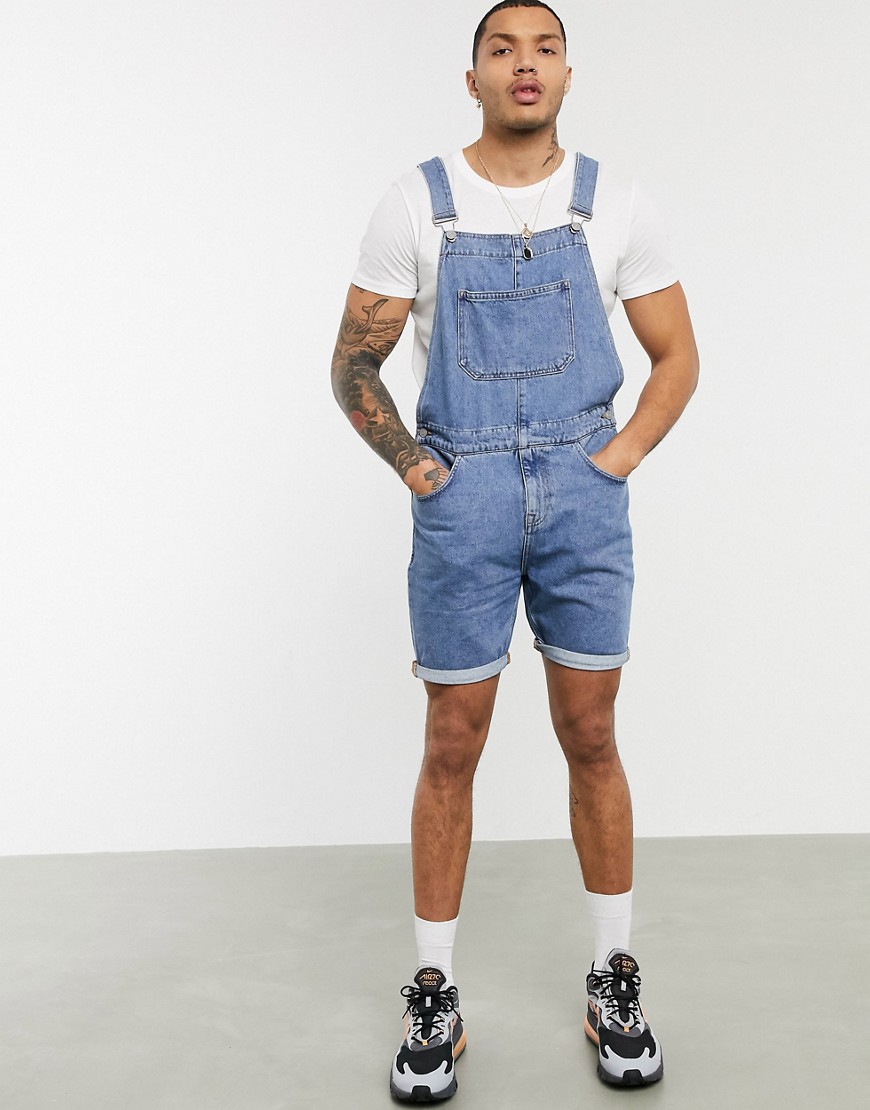 ASOS DESIGN denim overall shorts in mid wash-Blue | The Fashionisto