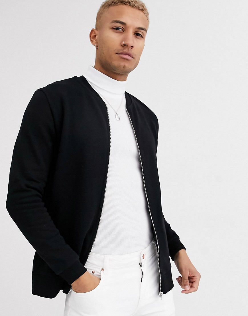 ASOS DESIGN jersey bomber jacket in black with side zips | The Fashionisto